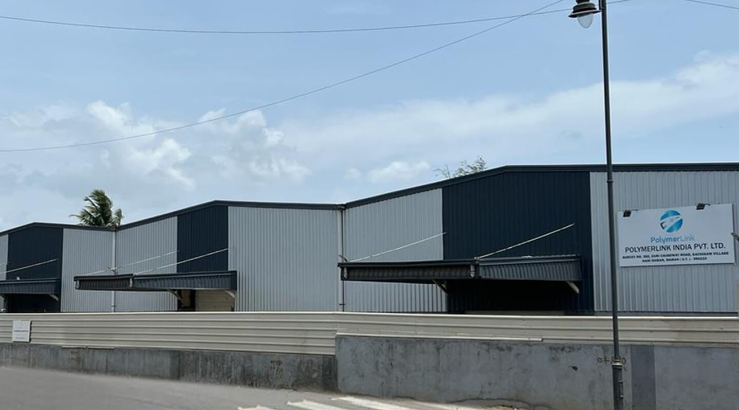 A black and white coloured building is the branch of Polymer Link India Pvt. Ltd. in India