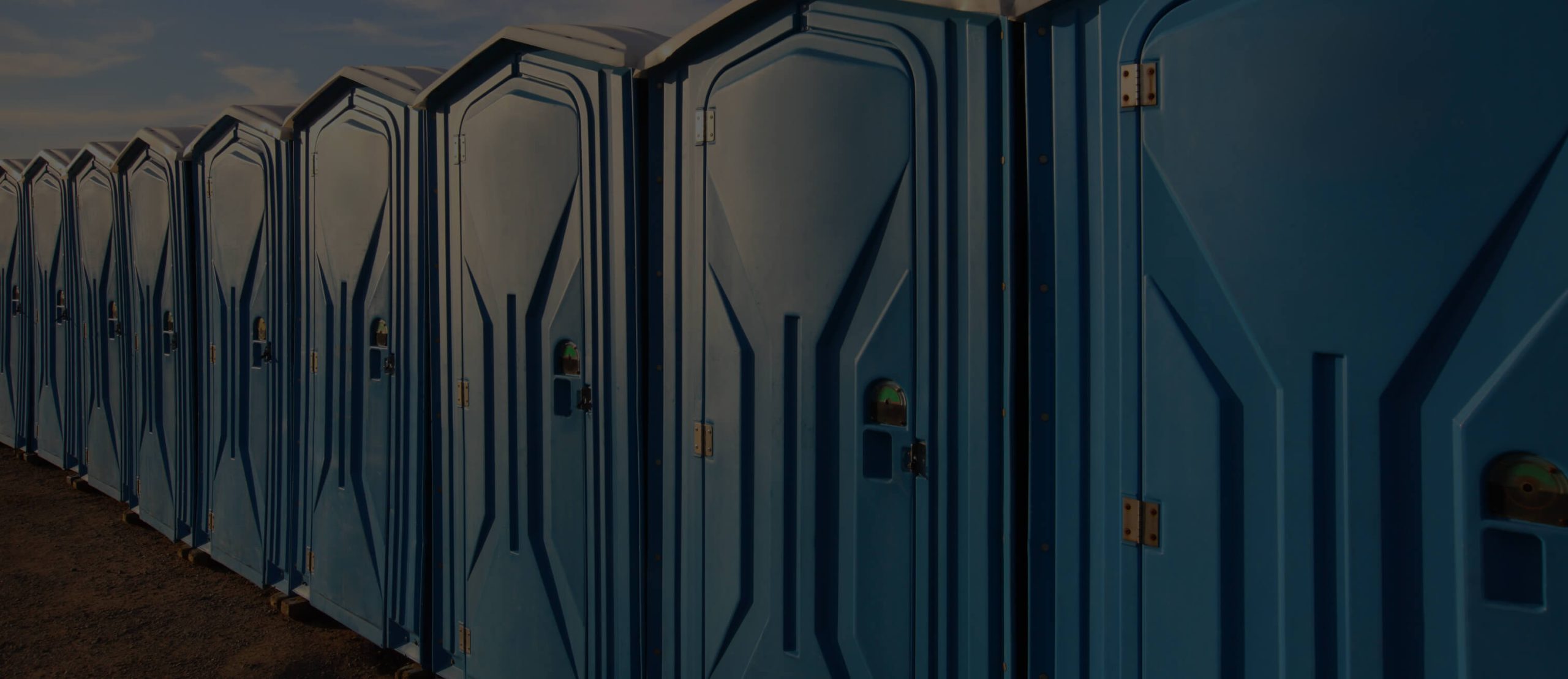 Blue portable toilets made from rotational moulding materials by Polymer Link