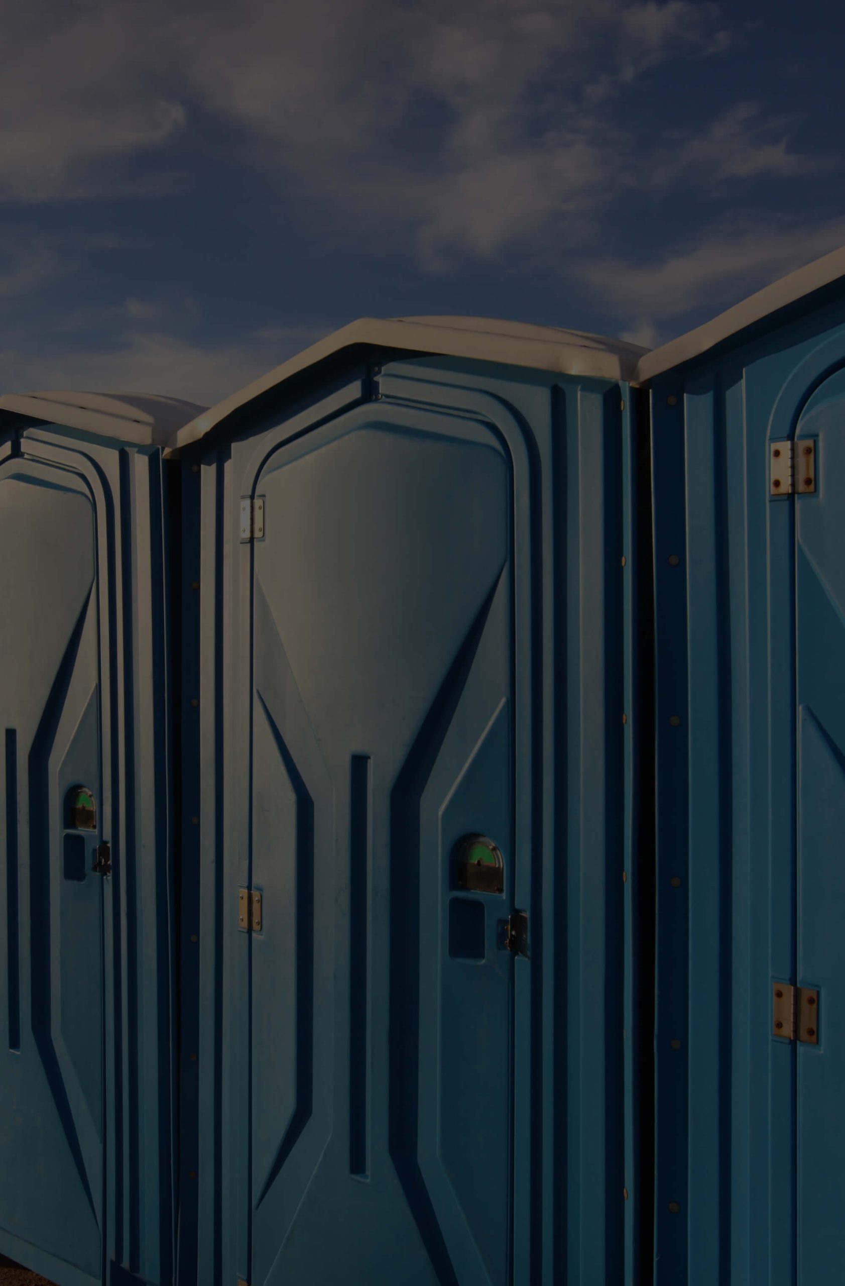 Blue portable toilets made from rotational moulding materials by Polymer Link