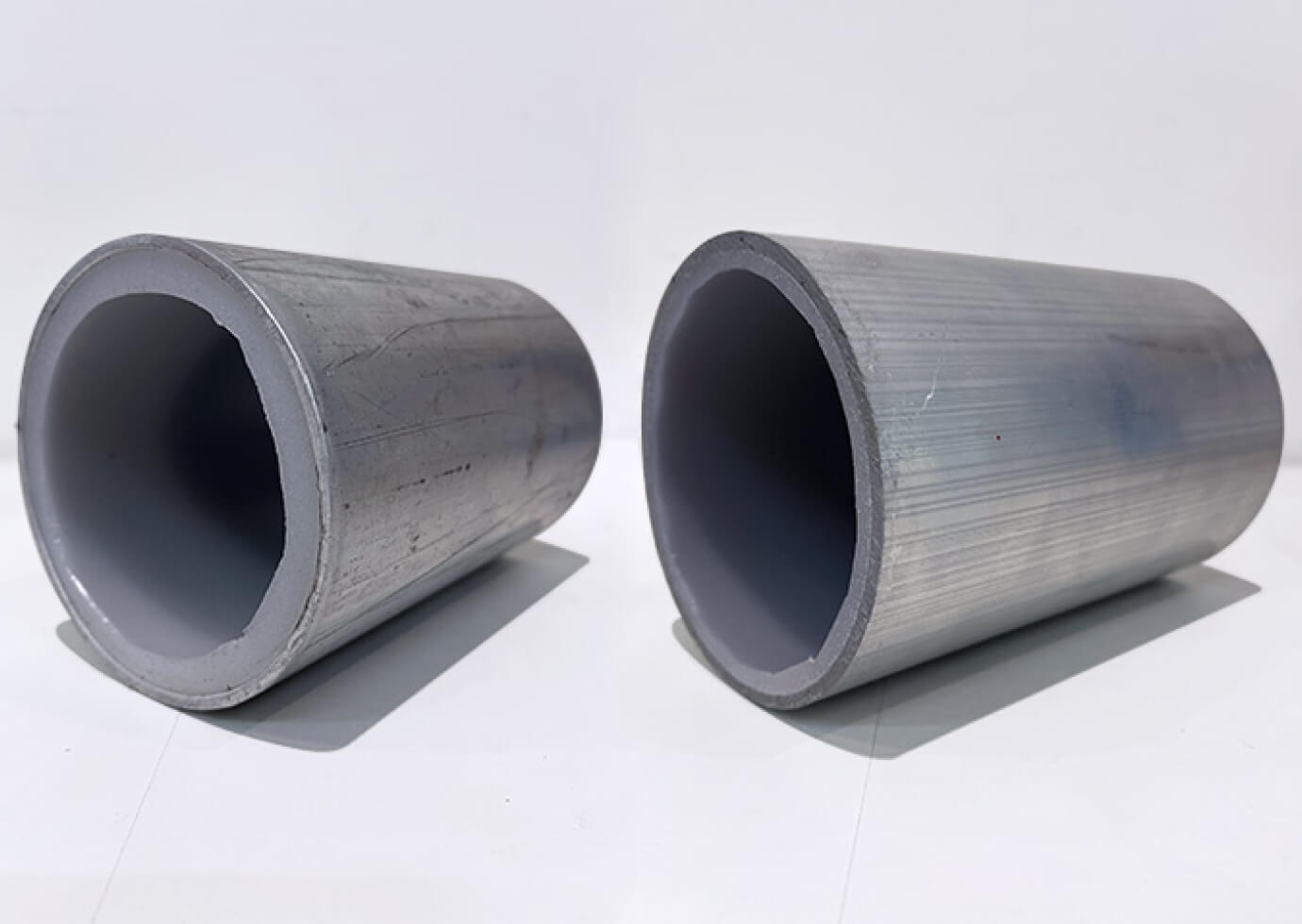 Two grey coloured pipelines were made using Polymer Link's Engineering Grade Rotolining Series, which can resist corrosion and withstand abrasion, providing a durable and high-quality product
