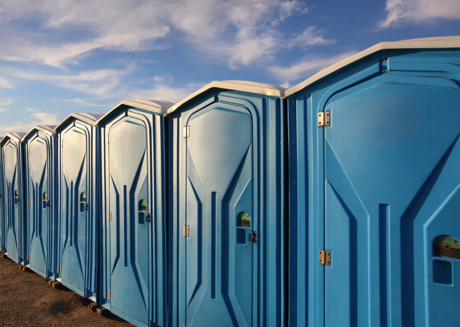 Blue portable toilets made from rotational moulding materials by Polymer Link