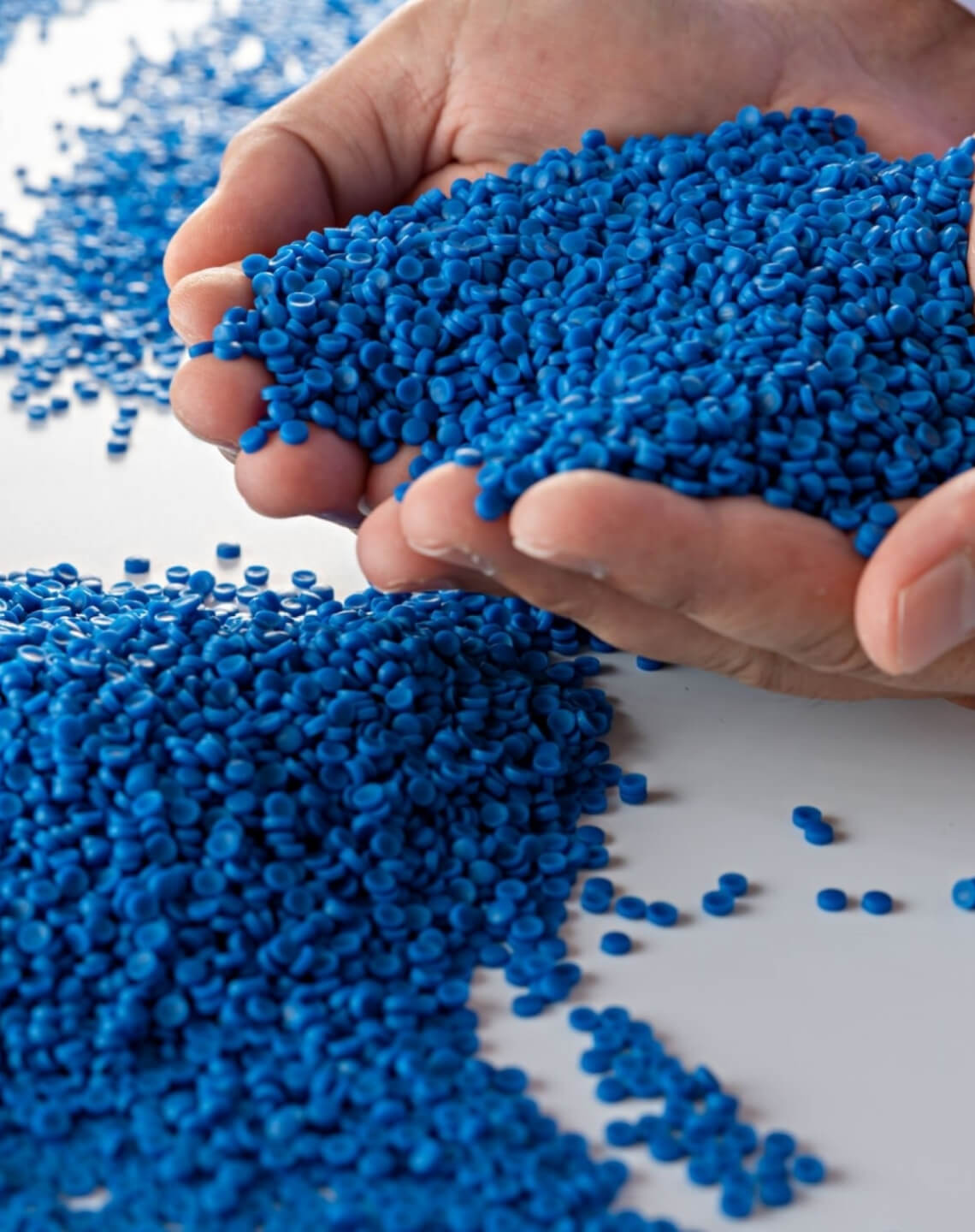 Two piles of blue coloured masterbatches manufactured by Polymer Link